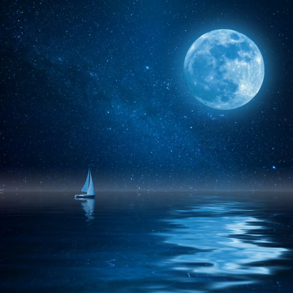 A boat under a beautiful moon