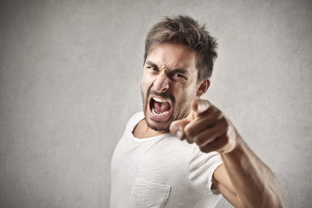 A man is shouting in anger